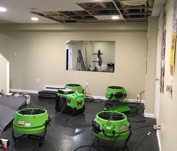 Commercial property with damaged ceiling and SERVPRO drying equipment