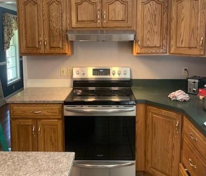 Clean kitchen with black stove