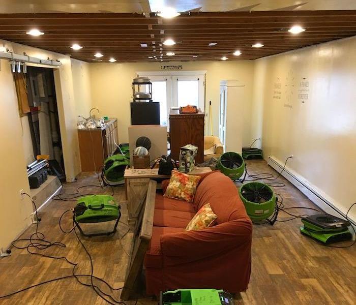  Room with SERVPRO drying equipment and open ceiling